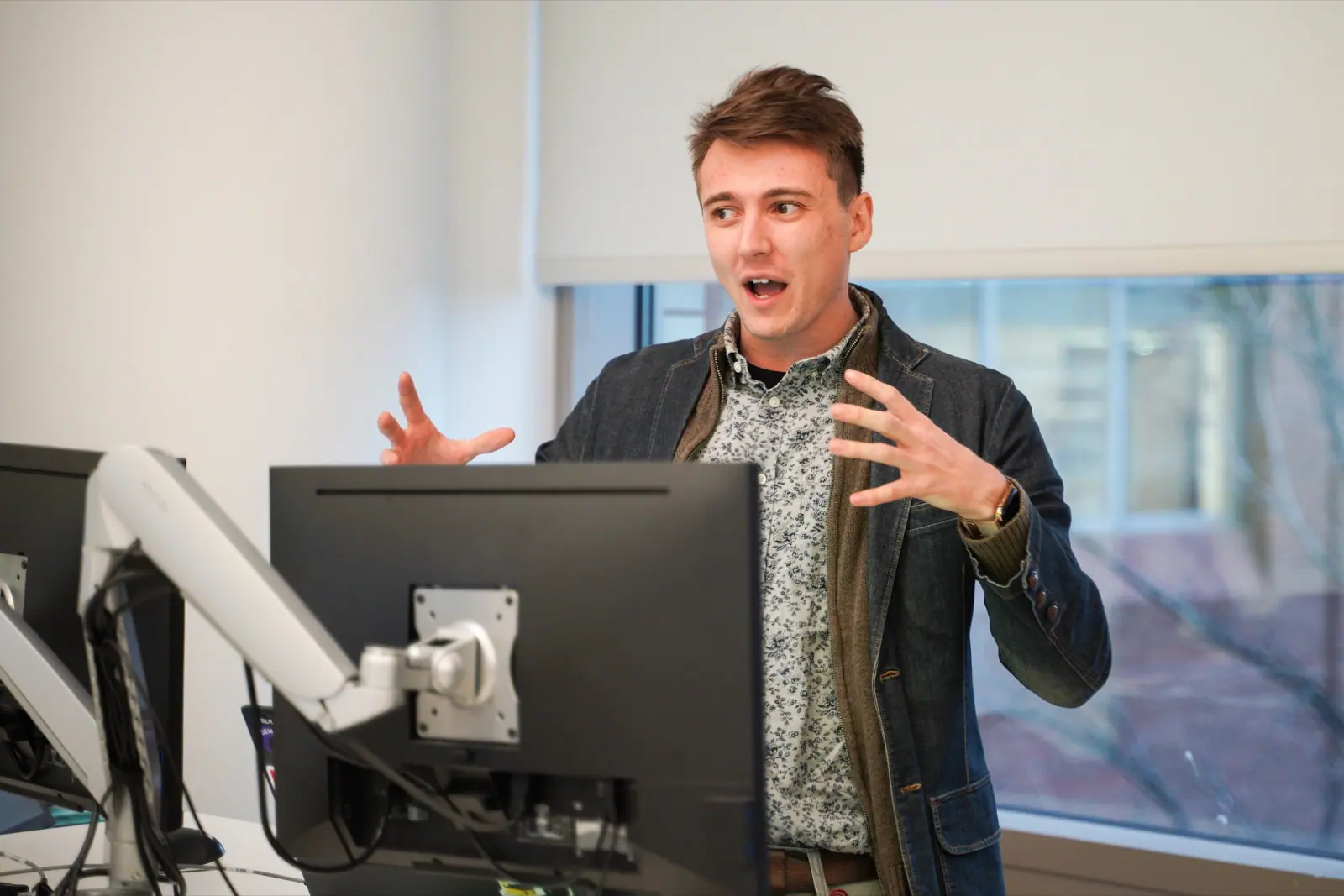 Ian Tyler Applebaum speaking during an HCI presentation